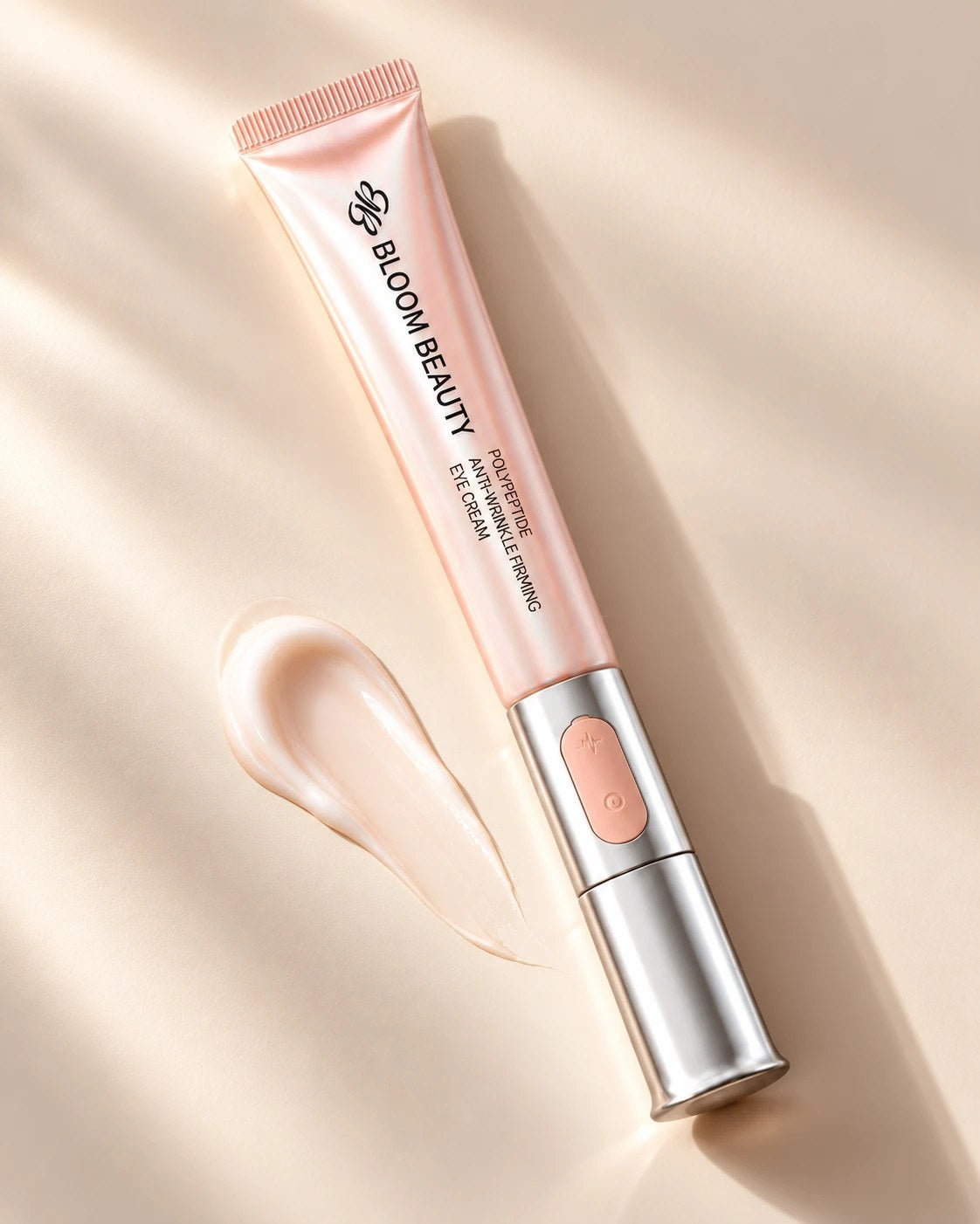 Bloom Beauty Eye Espresso: a peach eye cream tube on a silver vibrating wand