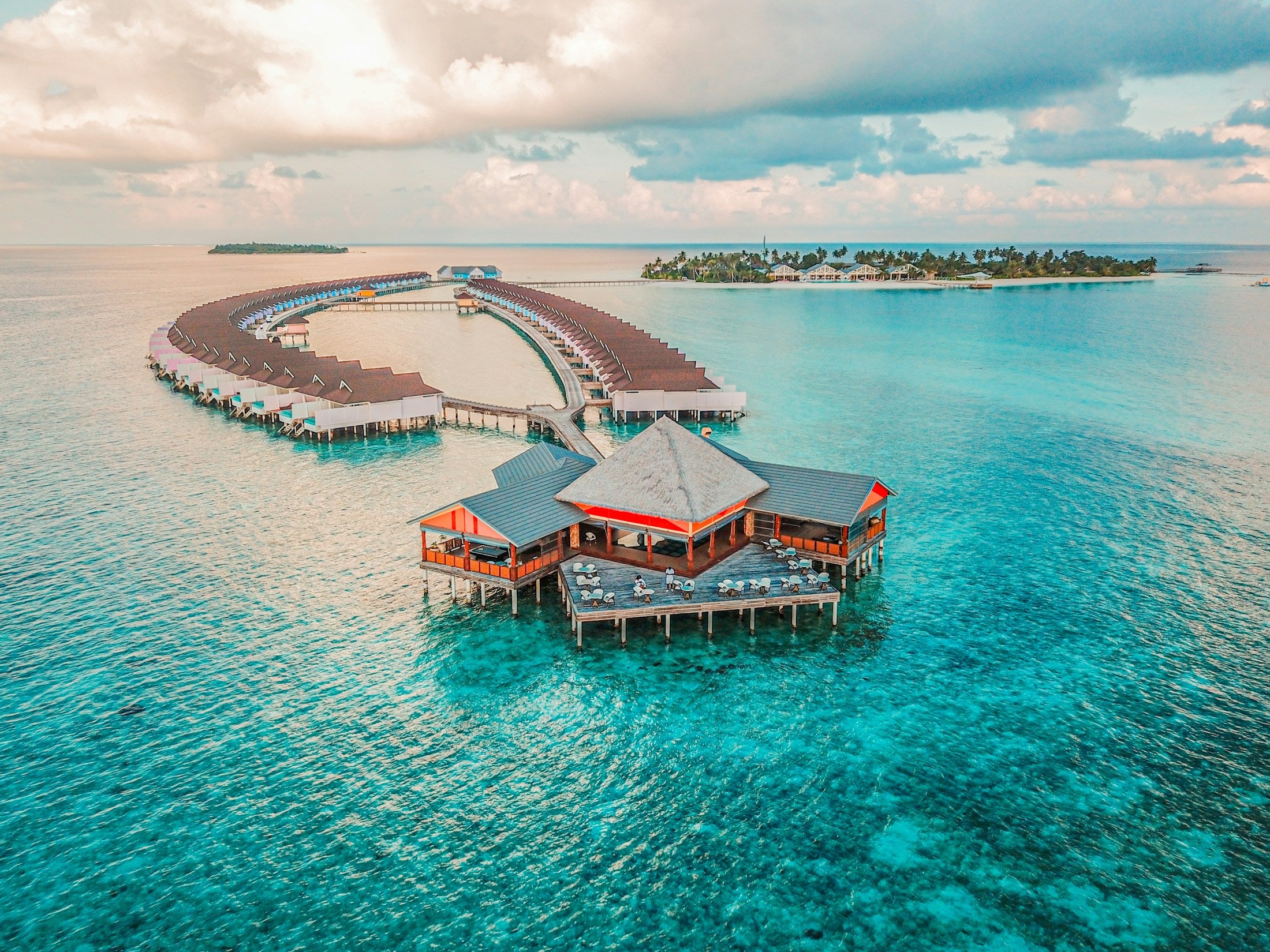 Overwater resort villas at dusk